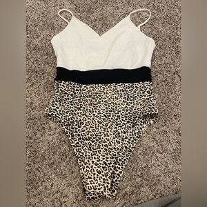 Kittenish one piece reversible swim suit